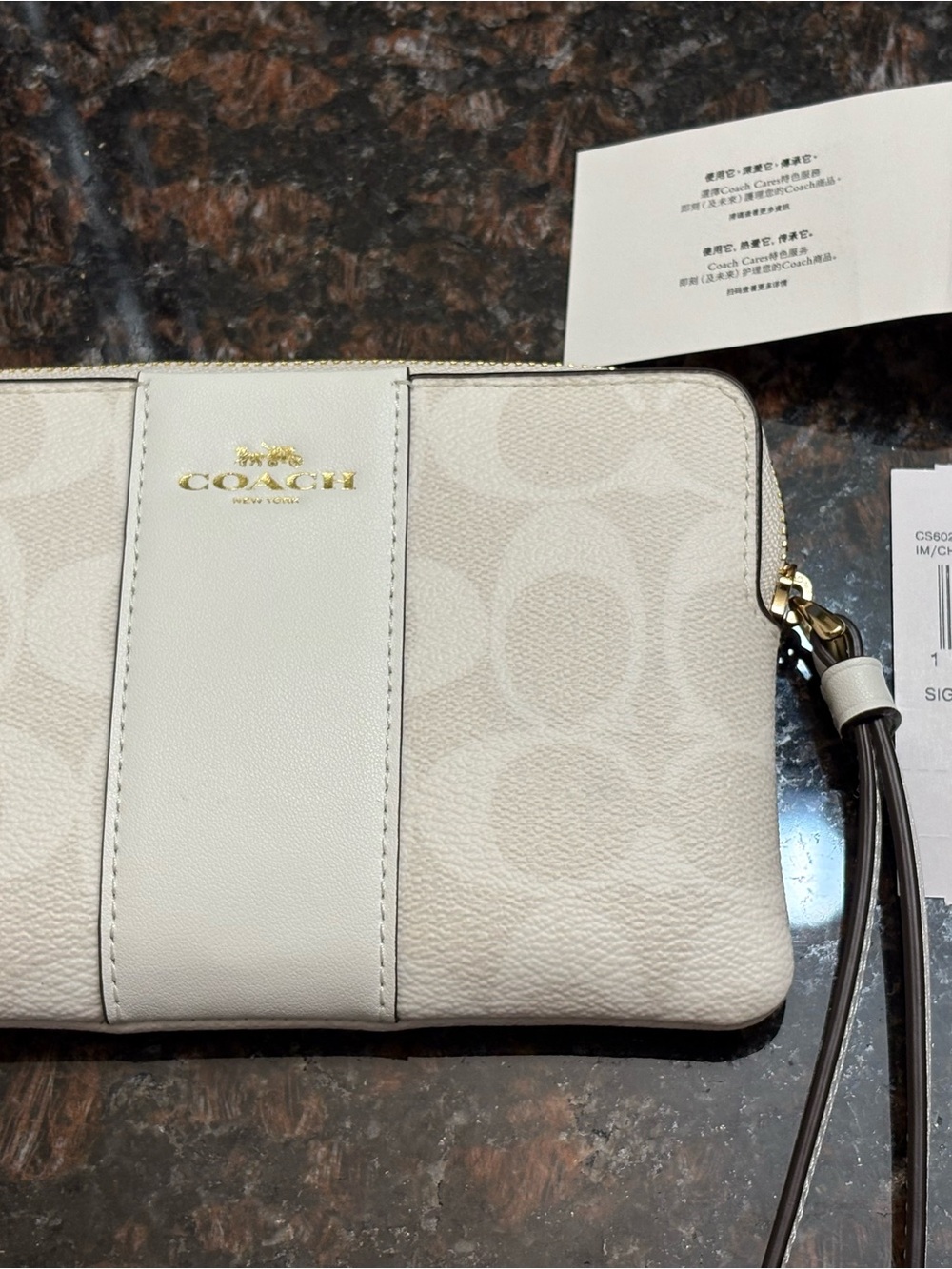 COACH Cream Signature Wristlet with Gold Logo Accent
